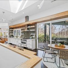 White Contemporary Eat-In Kitchen With Skylight 