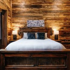 Rustic Bedroom With Reclaimed Wood Paneling