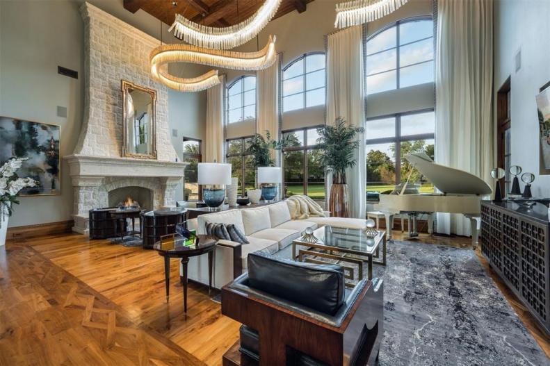 Living Room With White Stone Fireplace