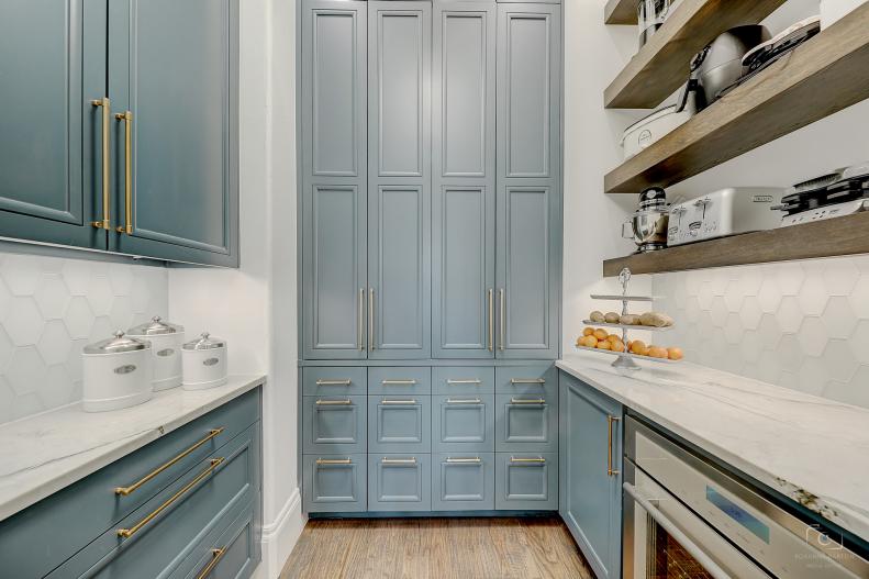 Blue and white butler pantry with wine fridge.