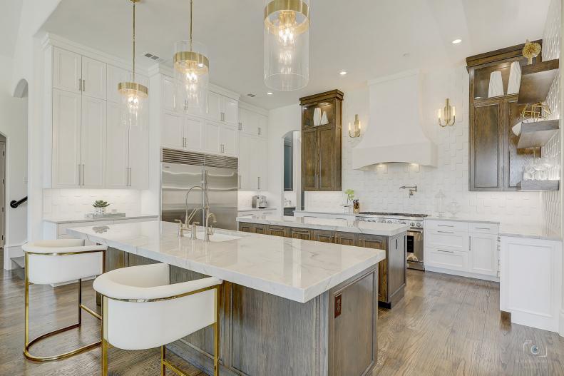 White kitchen with gold accents. 