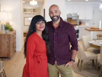 Raisa and Austin posing in the dining room after renovation