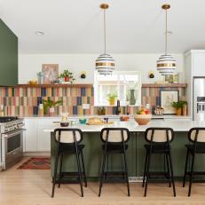 Eclectic Kitchen With Multicolor Backsplash and Green Island
