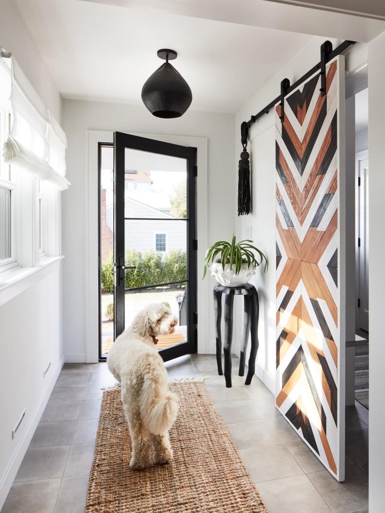 Black and White Boho Entryway With Custom Barn Door