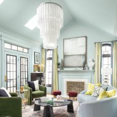 Eclectic Light Blue Living Room with Dramatic Chandelier 