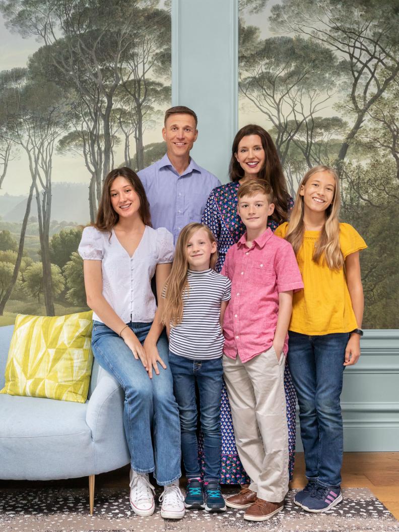 Family Portrait in Eclectic Living Room with Mural