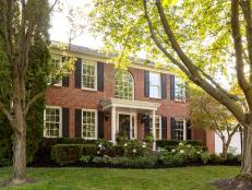 Colonial Home with Red Brick and Black Shutters