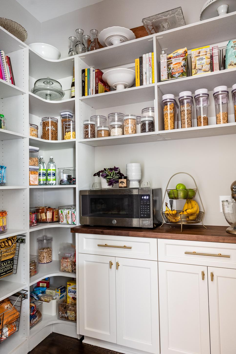 Organized Pantry With White Cabinets And Butcher Block Countertops 