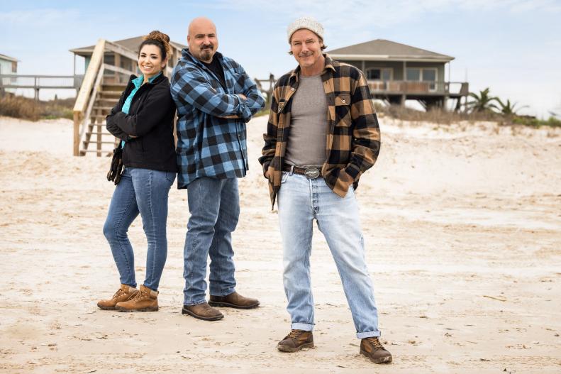 As seen on HGTV's Battle on the Beach Season 2, mentor Ty Pennington poses with his team, Jaqueline and Wally, on the beach.  (Portrait)