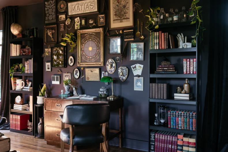 Thrifted, repurposed, and hand-crafted elements come together to create a chic gallery wall in this Dark Academia-inspired bedroom makeover.