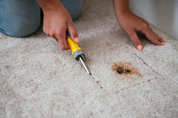 Cutting Away a Stained Piece of Carpet