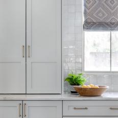 Stunning Off-Gray Cabinetry and Square White Tile Backsplash