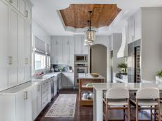 Transitional Kitchen With White Walls and Hints of Wood