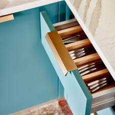 Blue Cabinetry With Gold Pulls
