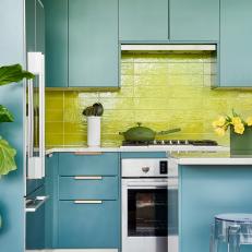 Bold Kitchen With Turquoise Cabinets, Plants and Lime Green Backsplash