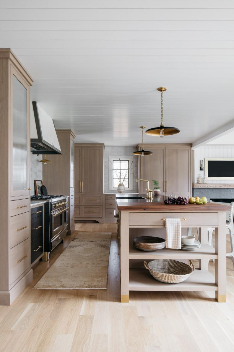 Transitional Kitchen With Light Wooden Colors and Island Table