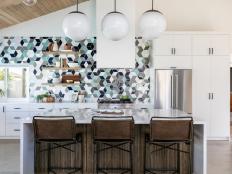 Mid-Century Modern Kitchen With Hanging Globe Lamps and Hints of Blue
