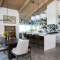 Mid-Century Modern Dining Room With Wooden Table, White Chairs and Vintage Rug