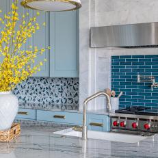 Blue Kitchen Accented With Colorful Forsythia