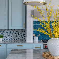 Contemporary Blue Kitchen With White and Gold Pendant