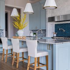 Beautiful Blue Kitchen With Seated Marble Island