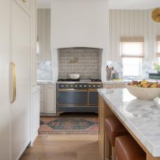 Neutral Transitional Chef Kitchen With Gray Stove