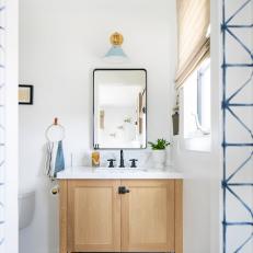 Neutral Contemporary Bathroom With Blue Sconce