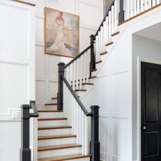 Black and Foyer With Wooden Staircase