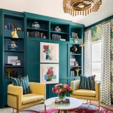 Sitting Room With Built-In Teal Shelving and Chic, Yellow Armchairs 
