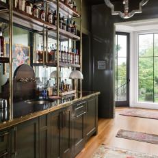 Industrial-Stye Home Bar With Forest Green Cabinets