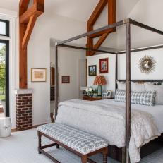 Classic Bedroom With Brick Columns and Exposed Beams