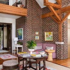 Living Space With Sitting Nook and Exposed Brick Walls