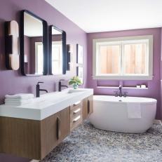 Modern Bathroom With Stone Floor and Purple Walls