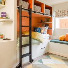 Kid's Room With Hints of Orange and Small Desk 