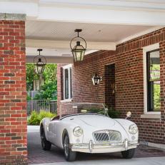 Brick Covered Driveway and Classic Car