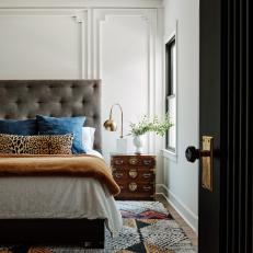 Neutral Bedroom With Patterns and Custom Wall Molding