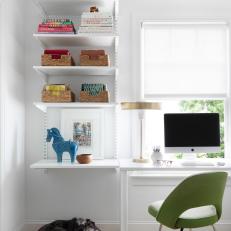 White Home Office With Green Chair and Globe