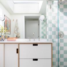 Green and White Bathroom With Checkered Tile