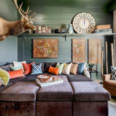 Green Rustic Family Room With Deer Head