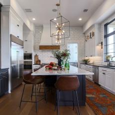 Black and White Chef Kitchen With Leather Barstools