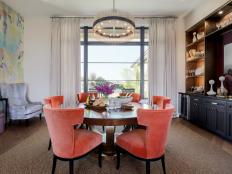 Multicolored Dining Room With Orange Chairs