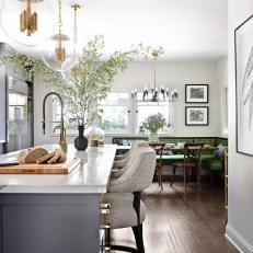 Gray and White Kitchen Island With Glass Pendant Light