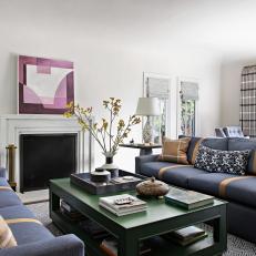 Living Room Features Navy Blue and Camel Sofas