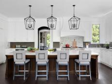 Black and White Kitchen, Three Pendants Above Four Chairs at Island