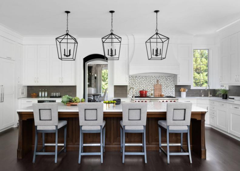 Black and White Kitchen, Three Pendants Above Four Chairs at Island