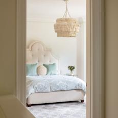 White Bedroom With Beige Shell Chandelier