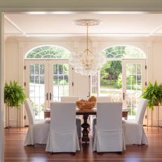 Dining Room With Arched French Doors and Bubble Chandelier