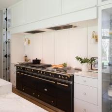 White Contemporary Kitchen With Black Stove