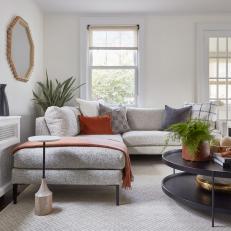 Transitional Neutral Living Room With Orange Throw