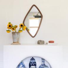 Unique Wood Mirror Accents a White Wall